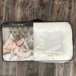 Brand New, never opened and never used, Dock A Tot Deluxe+ in Pristine White